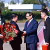 越南政府总理范明政抵达万象。图自越通社