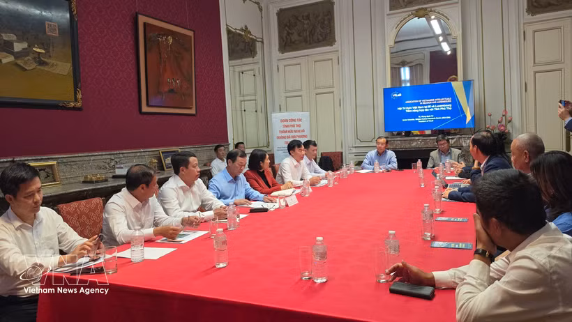 工作会谈现场。图自越通社