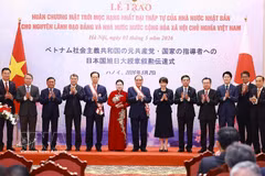 越南政府总理黎明兴、日本首相高市早苗同各位代表合影。图自越通社
