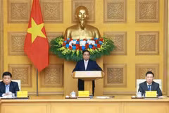 2 月 28 日下午，越南政府总理范明政在河内与中国企业代表举行座谈会。图自越通社