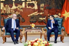 越南政府总理范明政会见国际海洋法法庭庭长托马斯·海达尔。图自越通社