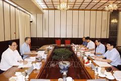 会议场景。图自越通社