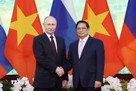 越南政府总理范明政和俄罗斯总统弗拉基米尔·普京。图自越通社