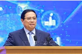 范明政总理发表讲话。图自越通社