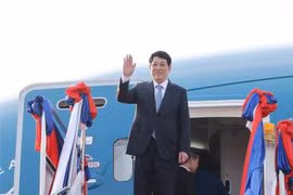 越南国家主席梁强l离开老挝首都万象瓦岱国际机场。图自越通社