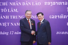 越共中央总书记苏林和老挝人民革命党中央总书记、国家主席通伦·西苏里。图自越通社