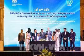 双方签署合作备忘录。图自越通社