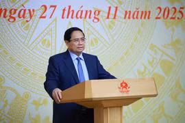 范明政在会上发表讲话。图自越通社