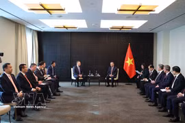 越共中央总书记、国家主席苏林会见俄罗斯扎鲁别日石油公司总经理谢尔盖·库德里亚绍夫。图自越通社