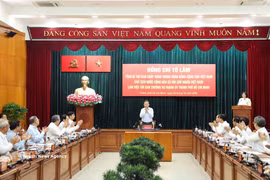 工作会谈现场。图自越通社