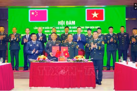 双方合作备忘录签署仪式。图自越通社