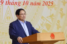 越南政府总理范明政主持全国会议。图自越通社