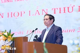 政府总理范明政发表讲话。图自越通社