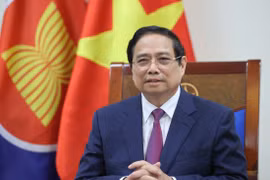 越南政府总理范明政就东盟成立58周年暨越南加入东盟30周年发表视频讲话。图自越通社