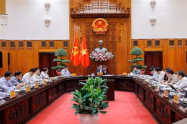 越南政府总理范明政主持召开政府常务委员会会议。图自越通社