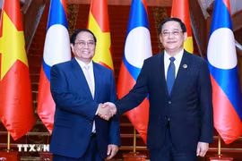 2024年10月8日，越南政府总理范明政会见老挝总理宋赛·西潘敦。图自越通社
