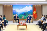 政府总理范明政会见美国联邦快递总裁理查德·史密斯。图自越通社