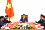 越南政府总理范明政同中国国务院总理李强通电话