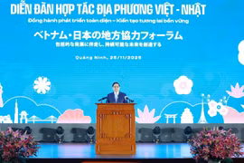 范明政总理出席越日地方合作论坛。图自越通社