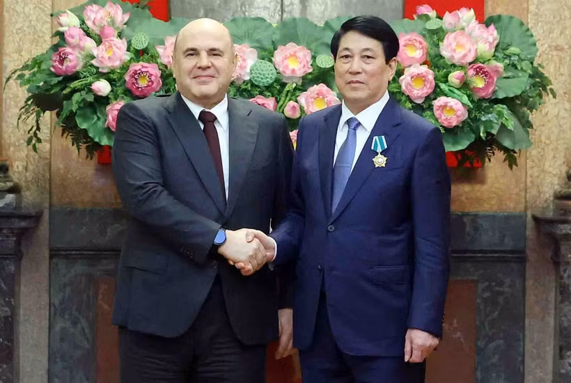 越南国会主席梁强与俄罗斯总理米舒斯京。图自越通社