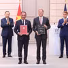 越共中央总书记、国家主席苏林见证越法合作文件交换仪式。图自越通社