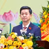 芹苴市市委书记、出席十四大的芹苴市代表团团长黎光松。图自越通社