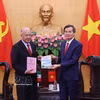 越共中央政治局委员、胡志明国家政治学院院长段明训副教授与墨西哥劳动党（PT）总书记阿尔贝托·阿纳亚·古铁雷斯。图自越通社