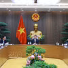 越南政府总理黎明兴与加拿大总理马克·卡尼通电话。图自越通社