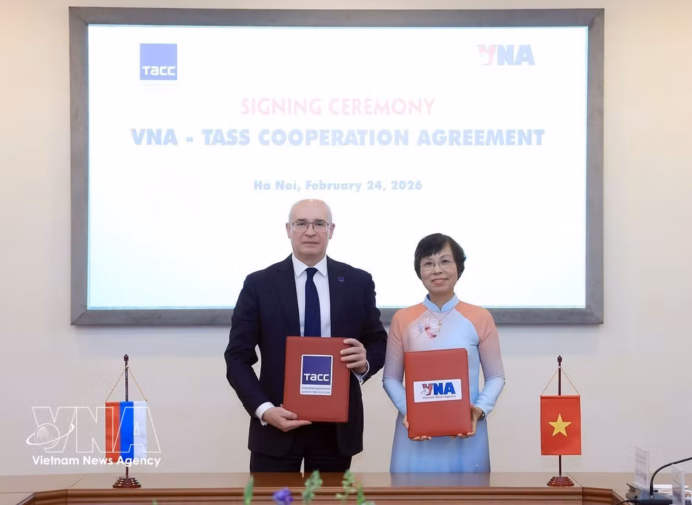 vnanet-potal-hoi-dam-giua-tong-giam-doc-va-tong-giam-doc-hang-thong-tan-tass-lien-bang-nga-8605467.jpg
