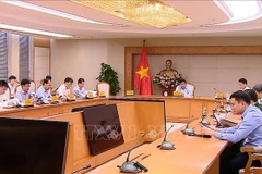 会议场景。图自越通社