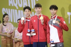 越南泳将辉煌摘下1500米自由泳金牌。图自越通社