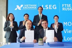 越南证券交易所（VNX）与富时国际有限公司（FTSE）签署合作备忘录。图自越通社
