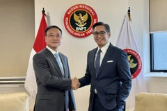 越南公安部副部长范世松中将与印尼国家反恐局副局长安迪卡·克里斯纳尤丹托（Andhika Chrisnayudhanto）。图自越通社
