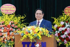 越共中央政治局委员、政府党委书记、政府总理范明政发表讲话。图自越通社