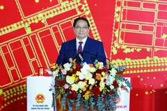 越南政府总理范明政发表讲话。图自越通社