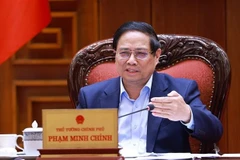 越南政府总理范明政发表讲话。图自越通社