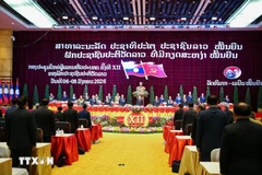 老挝人民革命党第十二次全国代表大会闭幕式。图自越通社