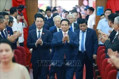 越共中央政治局委员、政府党委书记、政府总理范明政出席越共科学与技术部第一次代表大会。图自越通社