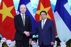 越南政府总理范明政2024年3月25日会见芬兰议会议长尤西·哈拉阿霍。图自越通社