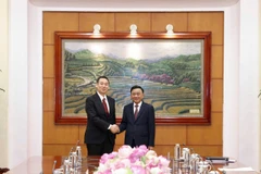 越共中央委员、书记处常务书记陈锦秀同志在越共中央驻地会见日本共产党书记局代局长、主席团副主席Tanaka Yu。图自越通社