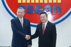 越共中央总书记苏林和东盟秘书长高金洪。图自越通社