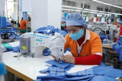 兴越纺织公司纺织厂。图自越通社