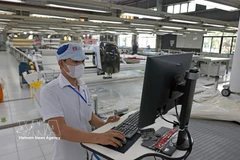 纺织品出口是促进经济增长的项目之一。图自越通社