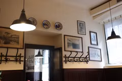 Antica Trattoria della Pesa餐馆内的胡志明主席肖像。图自越通社