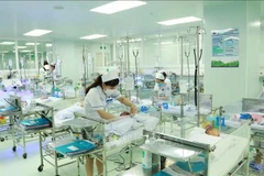 国会常委会第46次会议：修改《人口法令》，取消“一孩或二孩”生育规定。图自越通社