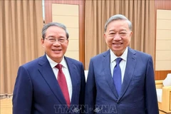 越共中央总书记苏林会见中国国务院总理李强。图自越通社