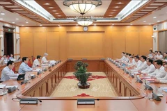 国家主席梁强主持会议。图自越通社