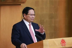 越南政府总理范明政发表讲话。图自越通社