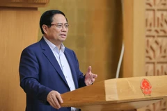 越南政府总理范明政发表讲话。图自越通社
