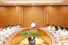越共中央政治局委员、书记处常务书记陈锦秀10月16日主持的一场会议。图自越通社